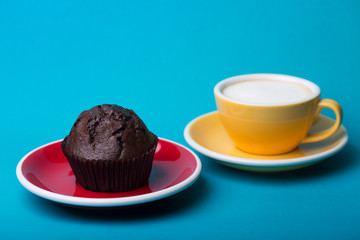 yellow cup  and chocolate cake