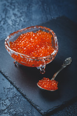 Salmon caviar in glass plate