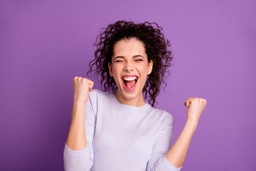 Close up photo of amazing wavy lady win competition yelling raising fists celebrating wear casual pullover isolated purple color background