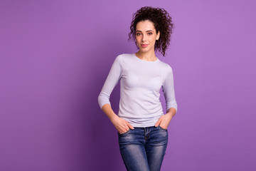Photo of charming wavy hairdo business lady company representative with beaming toothy smile holding hands in pockets wear pullover isolated purple color background