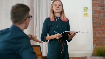 Hot Disscussion at Work: Business Woman Team Leader or Trainer is Presenting Project to Employees in Loft Office. Seminar in Diverse Group of People. Meeting at Work. 4K Medium Gimbal Orbit Shot