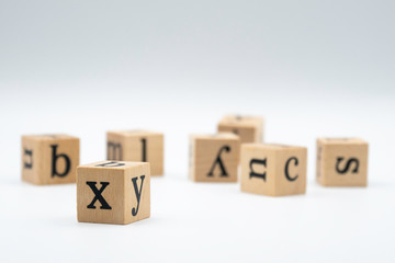 Wooden alphabet blocks isolated on white background.