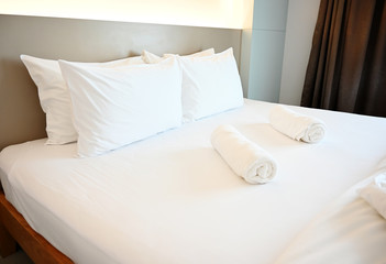 Naklejka na ściany i meble White pillows on the mattress in Modern style bedroom