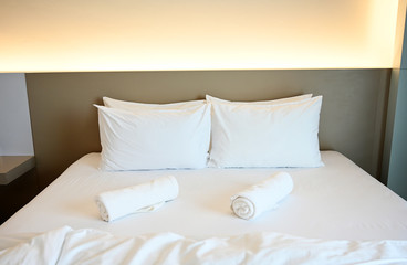 Fototapeta na wymiar White pillows on the mattress in Modern style bedroom