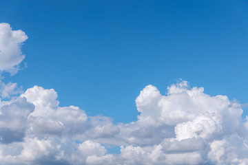 Naklejka na ściany i meble Beautiful cirrus clouds on blue sky on a sunny day background texture