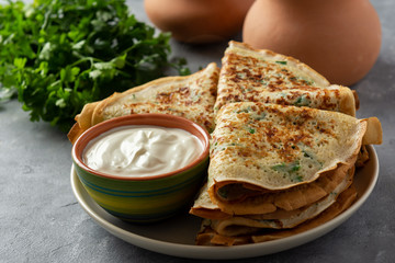 Savory pancakes (crepes) with parsley.