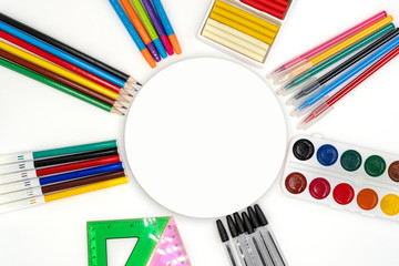 Colorful school supplies in circle arrangement on white background, back to school concept. Sale of school supplies and stationery. round Space for text