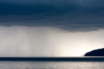 Wall of rain in a storm over the surface of lake Baikal
