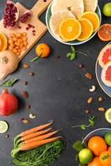 healthy eating, vegetarian food, diet and culinary concept - different vegetables and fruits on on slate table