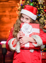 Prepare surprise gift. Open gift. Happy moments. Winter holidays. Shopping and sale. Christmas is time for giving. Festive atmosphere christmas day. Girl santa claus costume hold christmas gift box