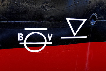 Plimsoll Line painted on a ship hull. An indication of the maximum depth to which the ship may be...