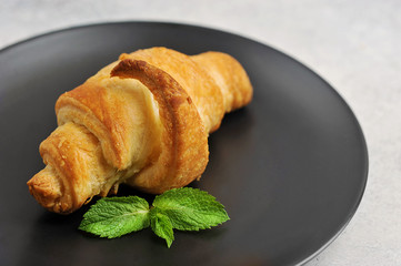 croissant on a black plate