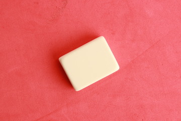 white eraser on color background