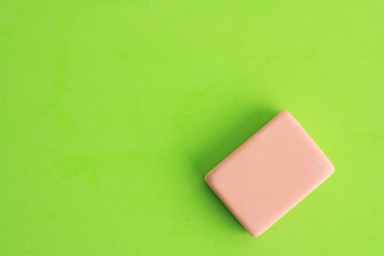 pink eraser on colorful background