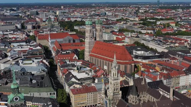 Aerial view of cityscape of Munich, Frauenkirche cathedral and Marienplatz square with iconic town hall in historic city center, capital city of Bavaria from above - Germany, Europe