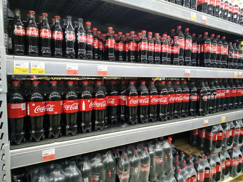 KEMEROVO, RUSSIA, FEBRUARY 14, 2019. Plastic bottles of Coca Cola on the shelves are sold in a hypermarket Lenta