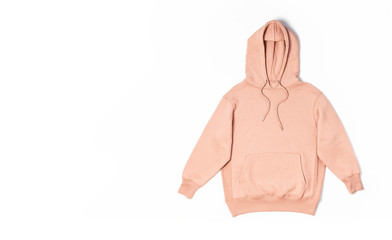Female peach pink sweatshirt with pocket and hood isolated on white background. Fashionable women's...
