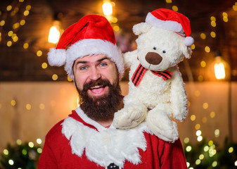 Kindness and generosity. Charity help. Spread joy happiness. Celebrate new year. Winter fundraising ideas. Charity concept. Man bearded Santa claus play with soft toy teddy bear. Christmas charity