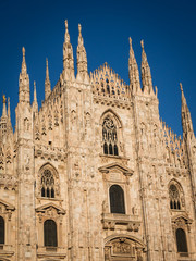 Fototapeta premium Ornate facade of Milan Catehdral in Italy at sunset