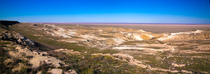 Panorama view to Aral sea from the rim of Plateau Ustyurt at sunset , Karakalpakstan, Uzbekistan