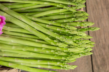 Asparagus with a wooden background