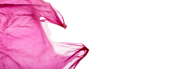 Pink plastic shopping bag on white.