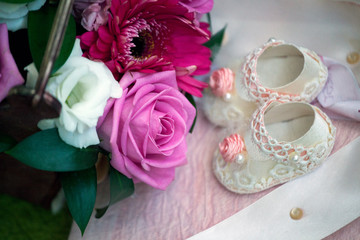 baby shoes rose flower background 