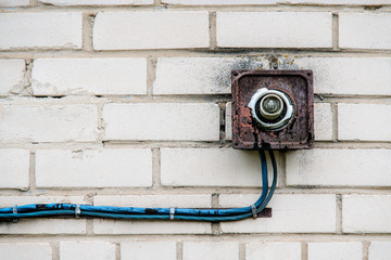 An old rusty lamp with a broken bulb