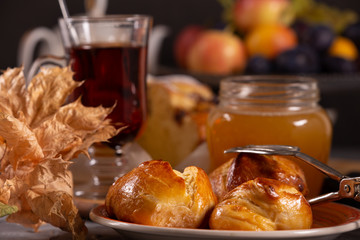 Fresh, tasty buns and tea with honey