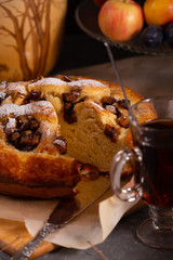 Fresh sweet fruit cake sprinkled with powdered sugar and cinnamon