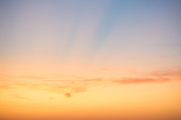 Sunset sky with red blue clouds and sun rays