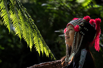 Hmong girl her have tooth braces and standing in the forest with a beautiful light in the morning...