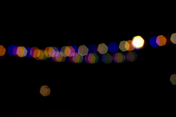 Christmas multi-colored lights on a black background, winter, bokeh, background