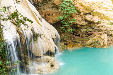 The waterfall flows into a beautiful natural water source.