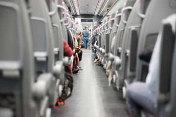 Aisle with seats in modern train, interior