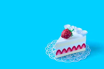 Paper piece of cake on openwork napkin