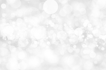 Obraz na płótnie Canvas Abstract background with White bokeh on gray background. christmas blurred beautiful shiny Christmas lights.