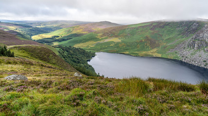 Wicklow way landscape Lough Tay Lake in a cloudy day.