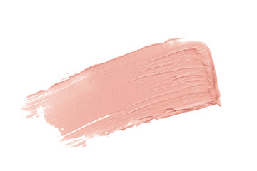 Color corrector stroke isolated on white background. Nude pink correcting cream concealer smudge smear swatch sample. Makeup base foundation creamy texture