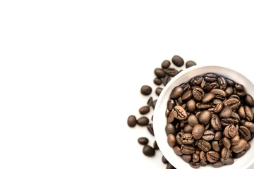 Coffee beans in white coffee cup isolated on white table desk with workspace. Copy space empty blank for text.Time to drink.