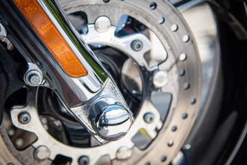 Fototapeta na wymiar Details of a chrome metal wheel of a sport motorbike