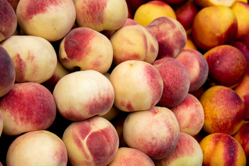 Fresh and juicy  peach fruits on a fruit market