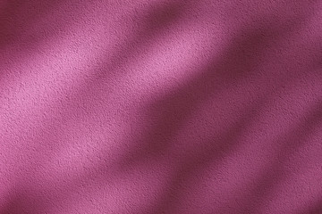 Tree shades on purple colored wall; abstract background.