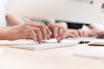Fototapeta premium close-up. a businesswoman uses a digital tablet sitting at her Desk
