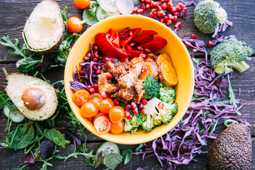 Healthy Buddha Bowl with Sweet Potato, Paprika, Chicken, Cherry Tomato and Broccoli