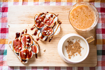Breakfast Concepts, Toasts with Cream Cheese, Figs, Pine Nuts and Raspberry Balsamic Sauce, Cup of Cappuccino and Carrot-Apple Juice