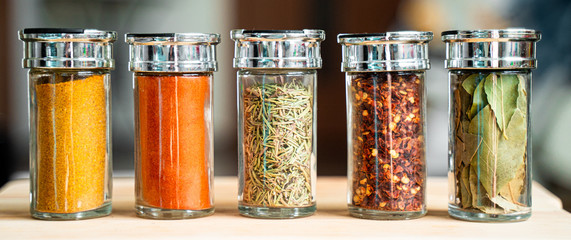Panoramic View of Different Kinds of Spices (Turmeric, Chilli Pepper, Chilli Pepper Powder, Rosemary and Bay Leaf)