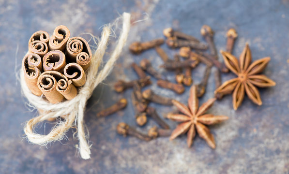Christmas or thanksgiving cooking, aromatic spices decoration background, cinnamon sticks, star anise and cloves