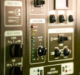 Fototapeta premium Close-up side view of panel of buttons and twirls