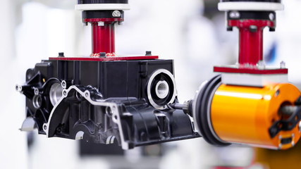 High precision CNC machining center independent axis movement  working, engineer control hand robot machining automotive sample part process in the factory